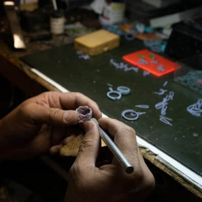 jeweller making a jewelry by hand